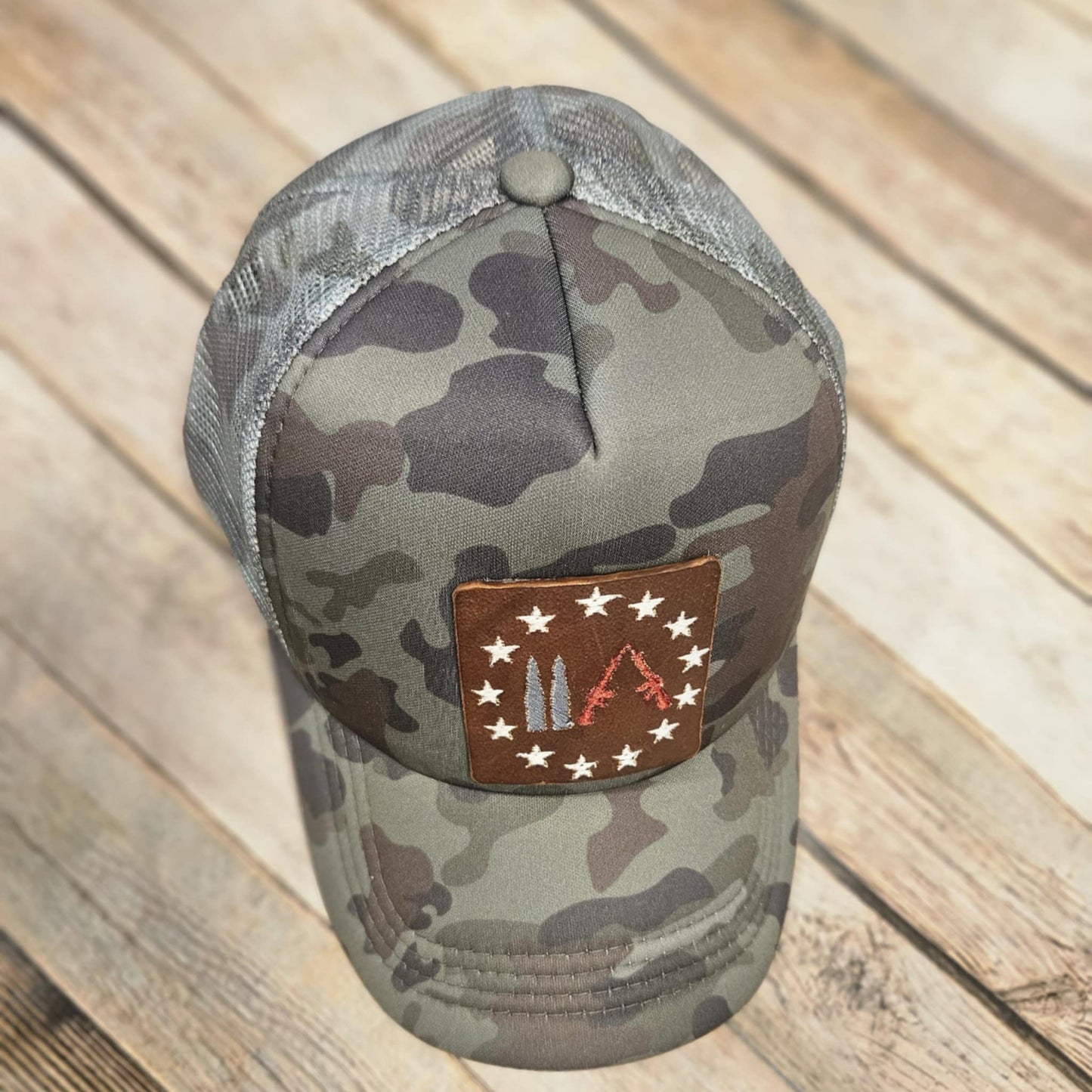 Embroidered Leather Gun Patch Trucker Hat