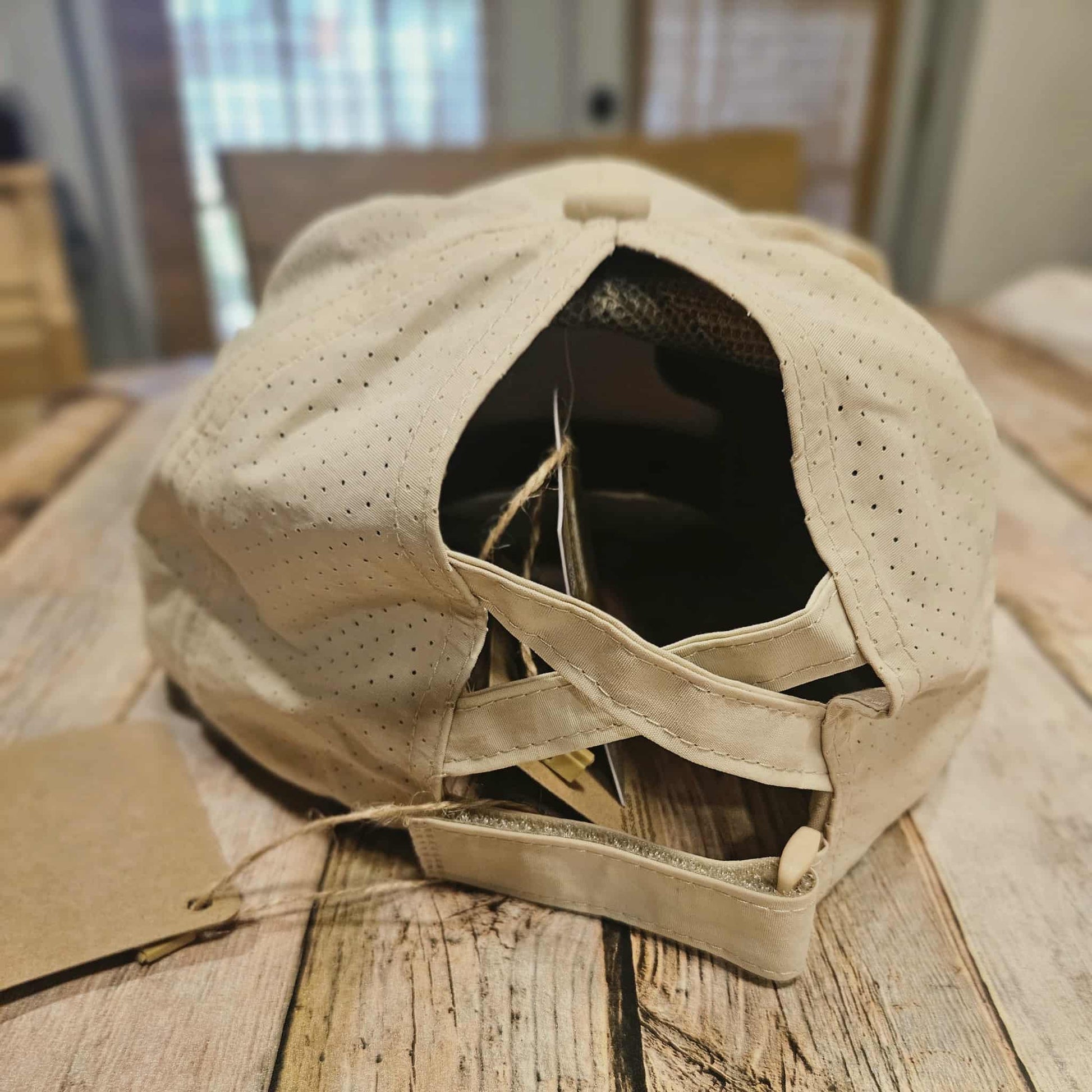 off white crisscross ponytail cap with "but God" embroidered leather patch