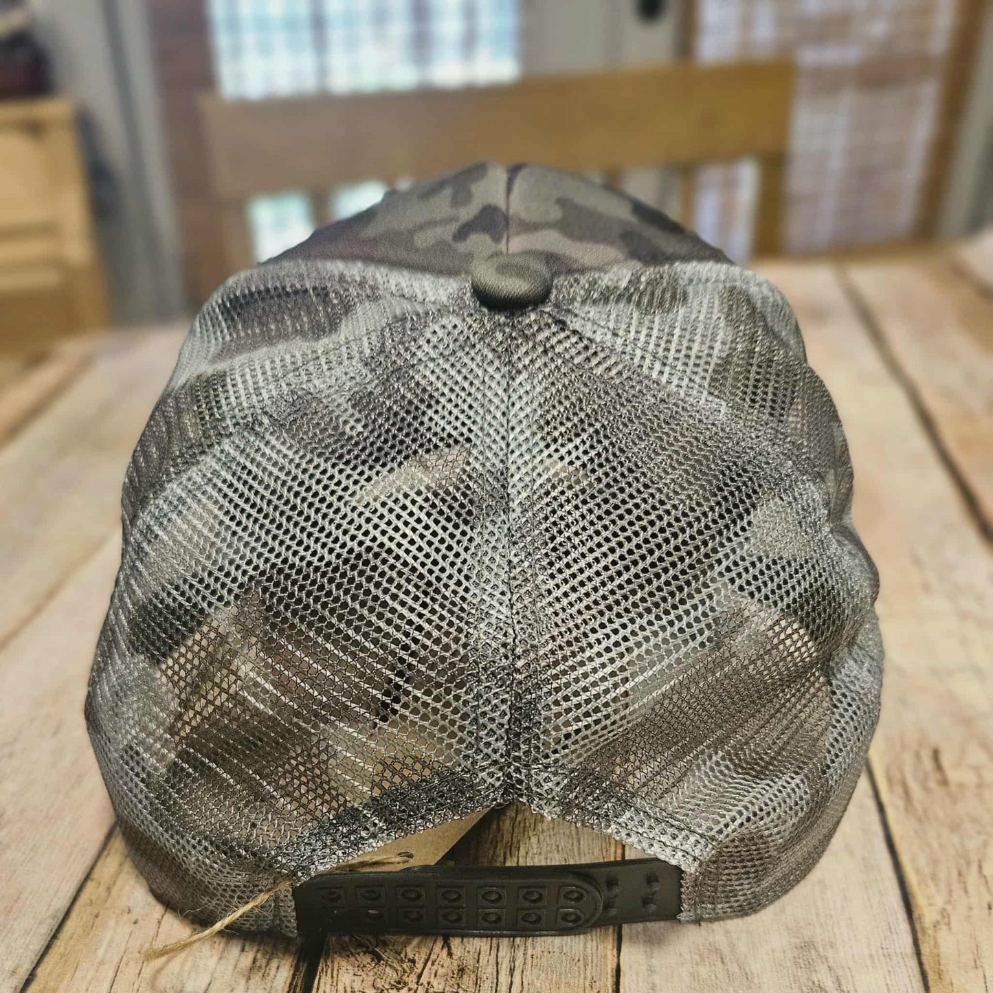 camo trucker cap with "But God" leather embroidered patch