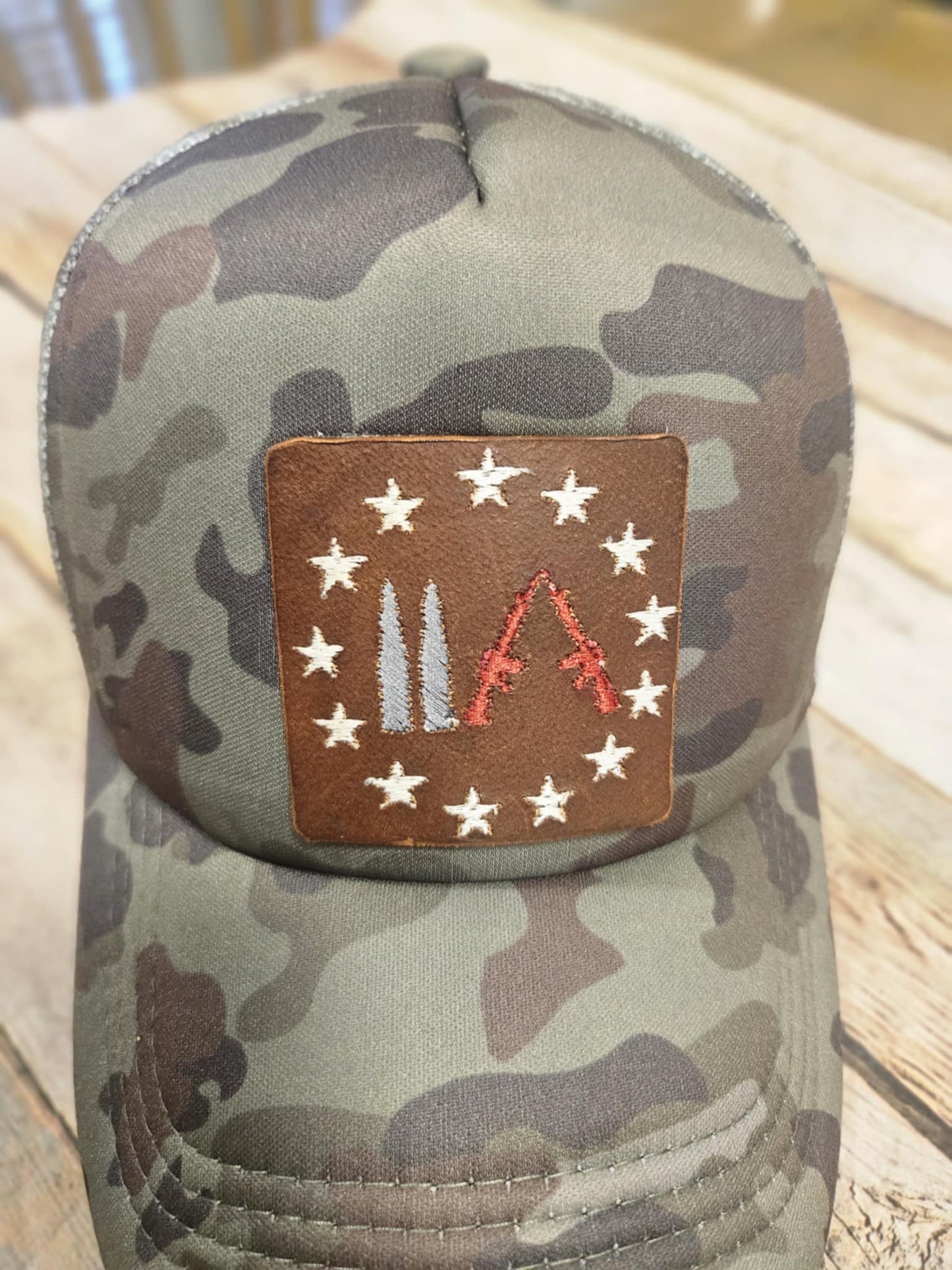 Embroidered Leather Gun Patch Trucker Hat