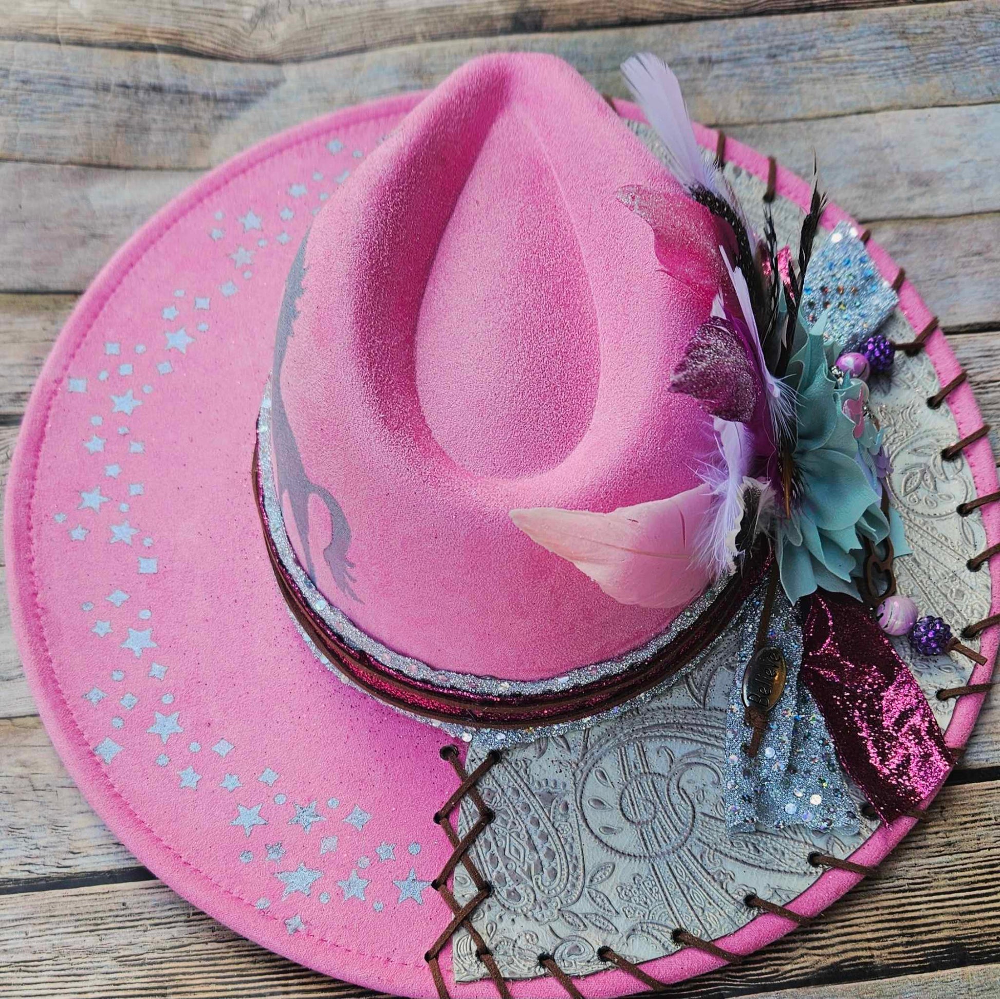 pink felt wide brim hat, unicorn painted hat, wide brim feathered hat, leather laced hat, hand crafted wide brim hat. adjustable pink hat