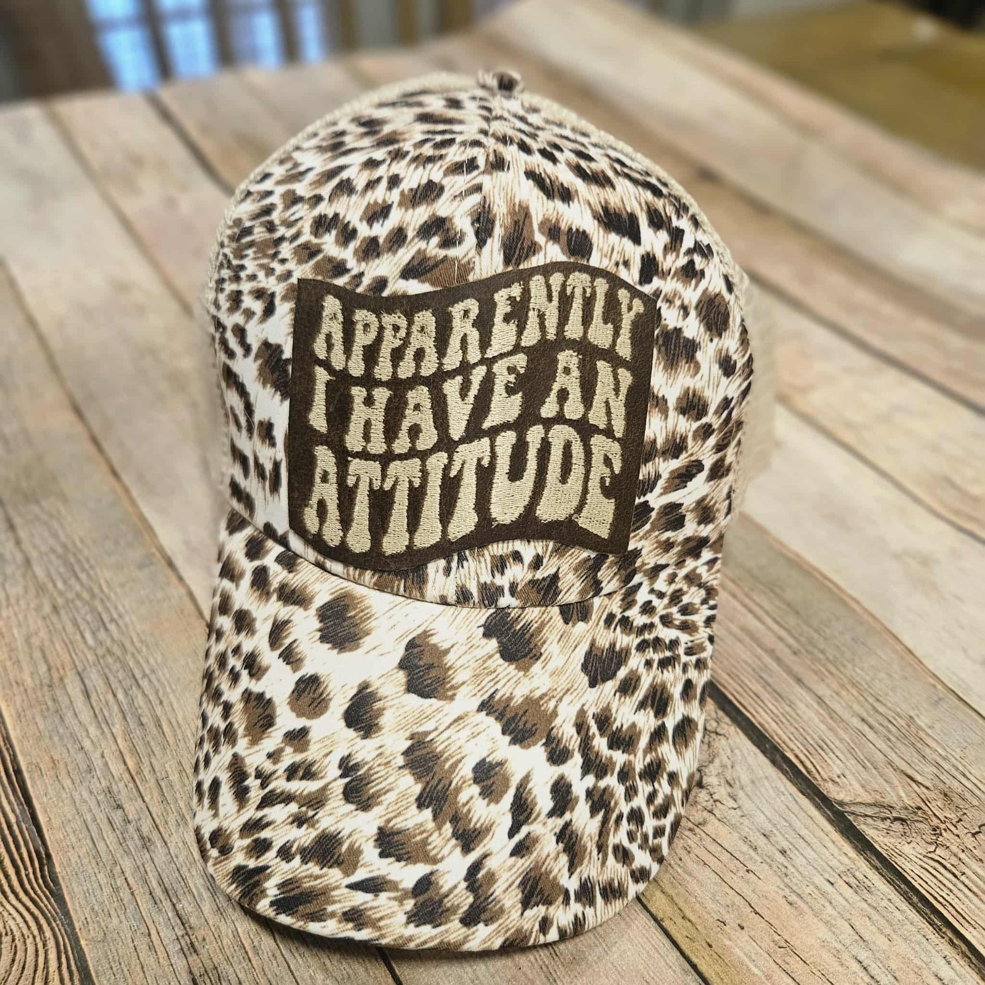 brown and cream leopard crisscross ponytail cap, leather apparently, I have an attitude embroidered patch cap