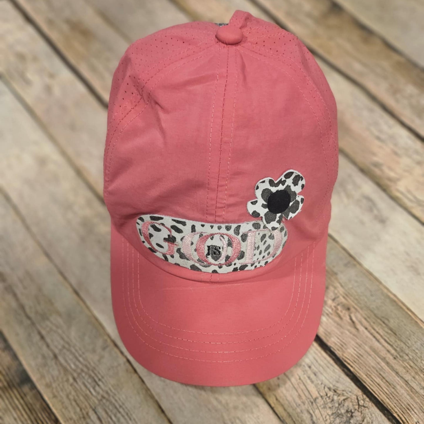 coral crisscross cap with black and white leopard leather "God is Good" patch