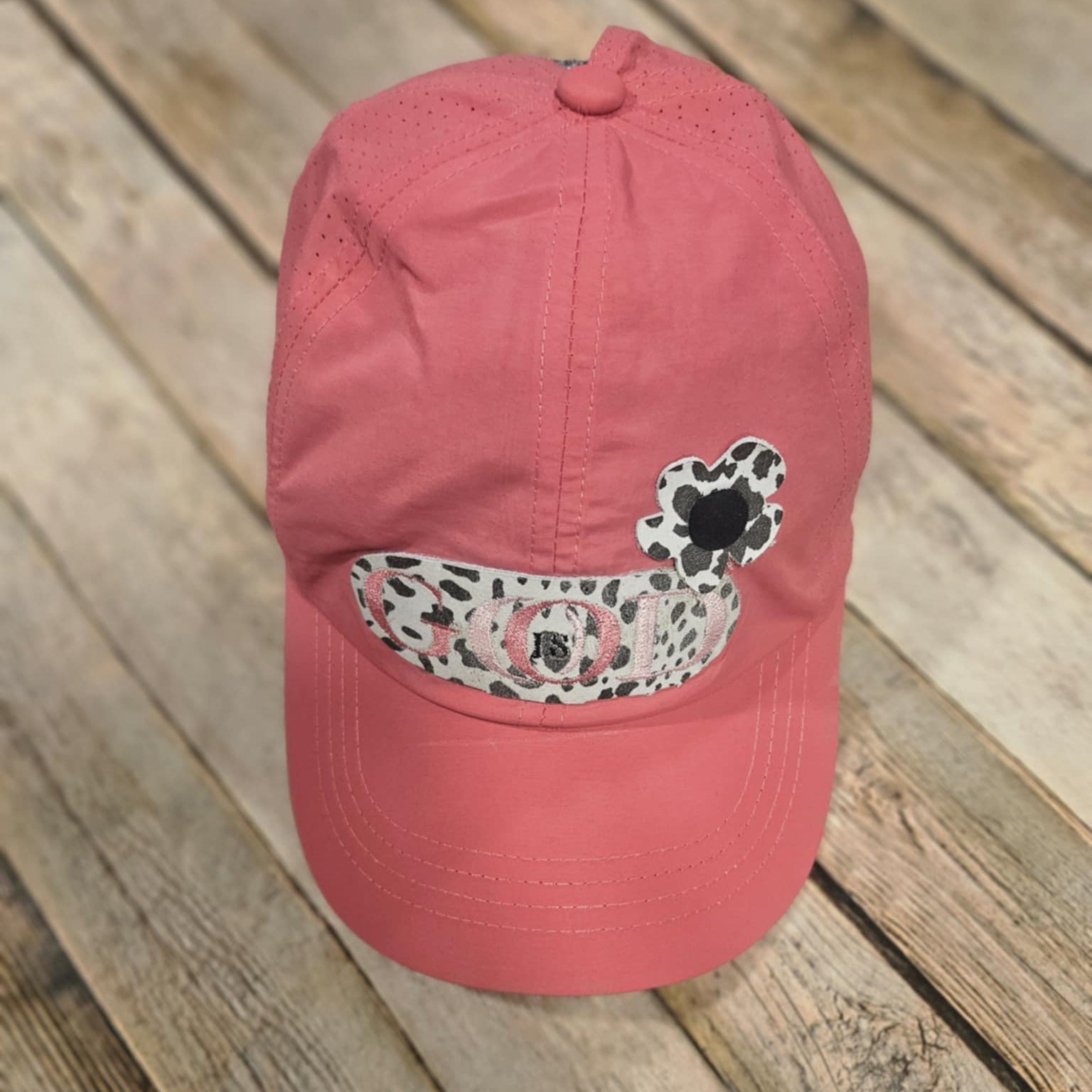 coral crisscross cap with black and white leopard leather "God is Good" patch