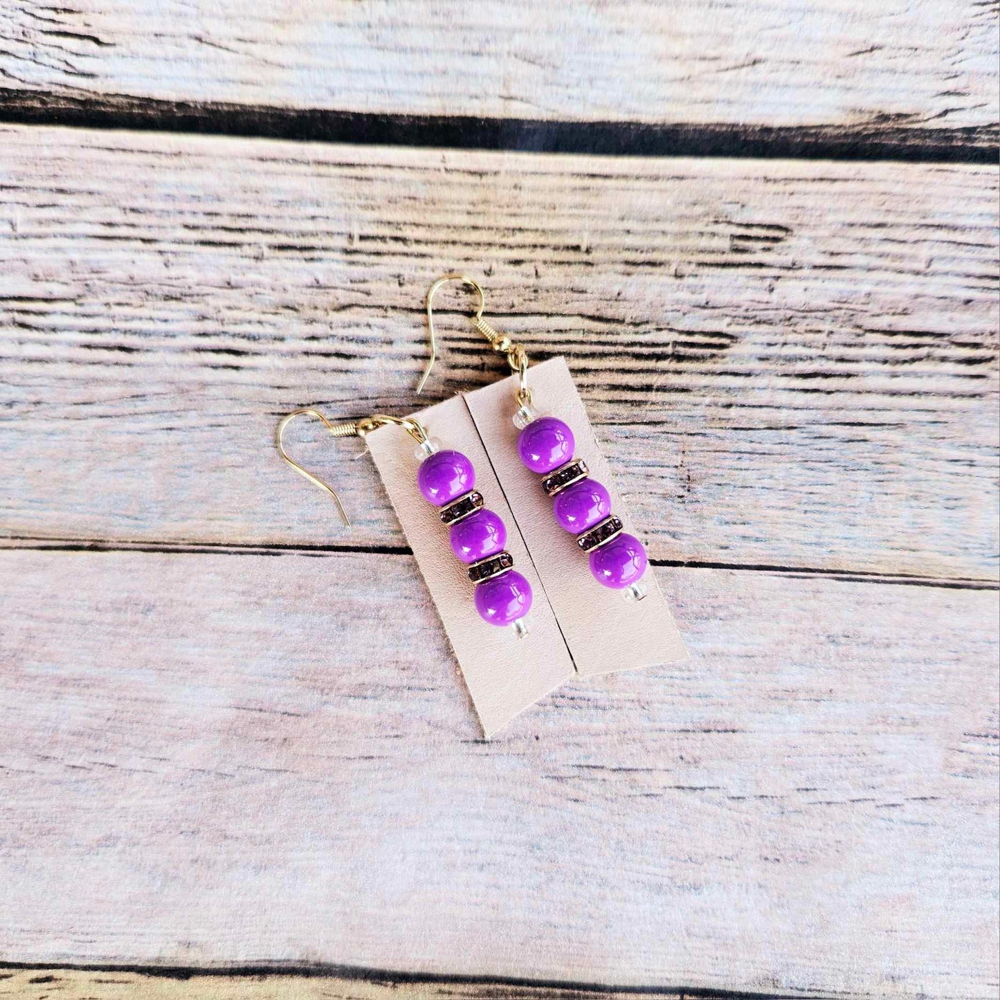 gold earrings, purple rhinestone and beaded earrings, vegetable tan leather jewelry, handmade jewelry