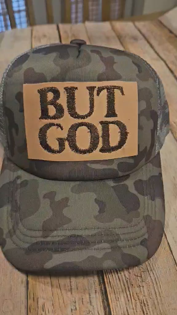 camo trucker cap with "But God" leather embroidered patch