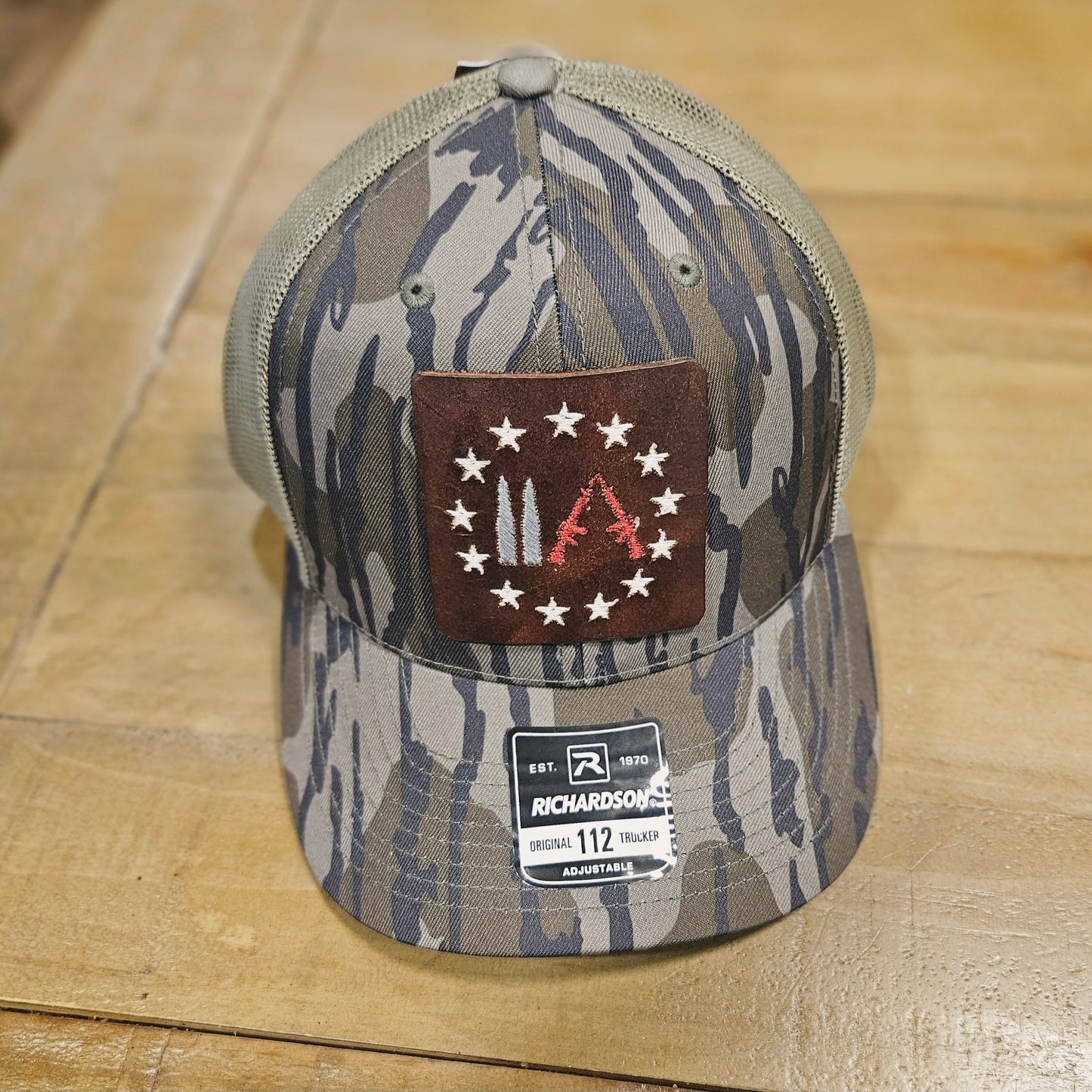 Embroidered Leather Gun Patch Trucker Hat