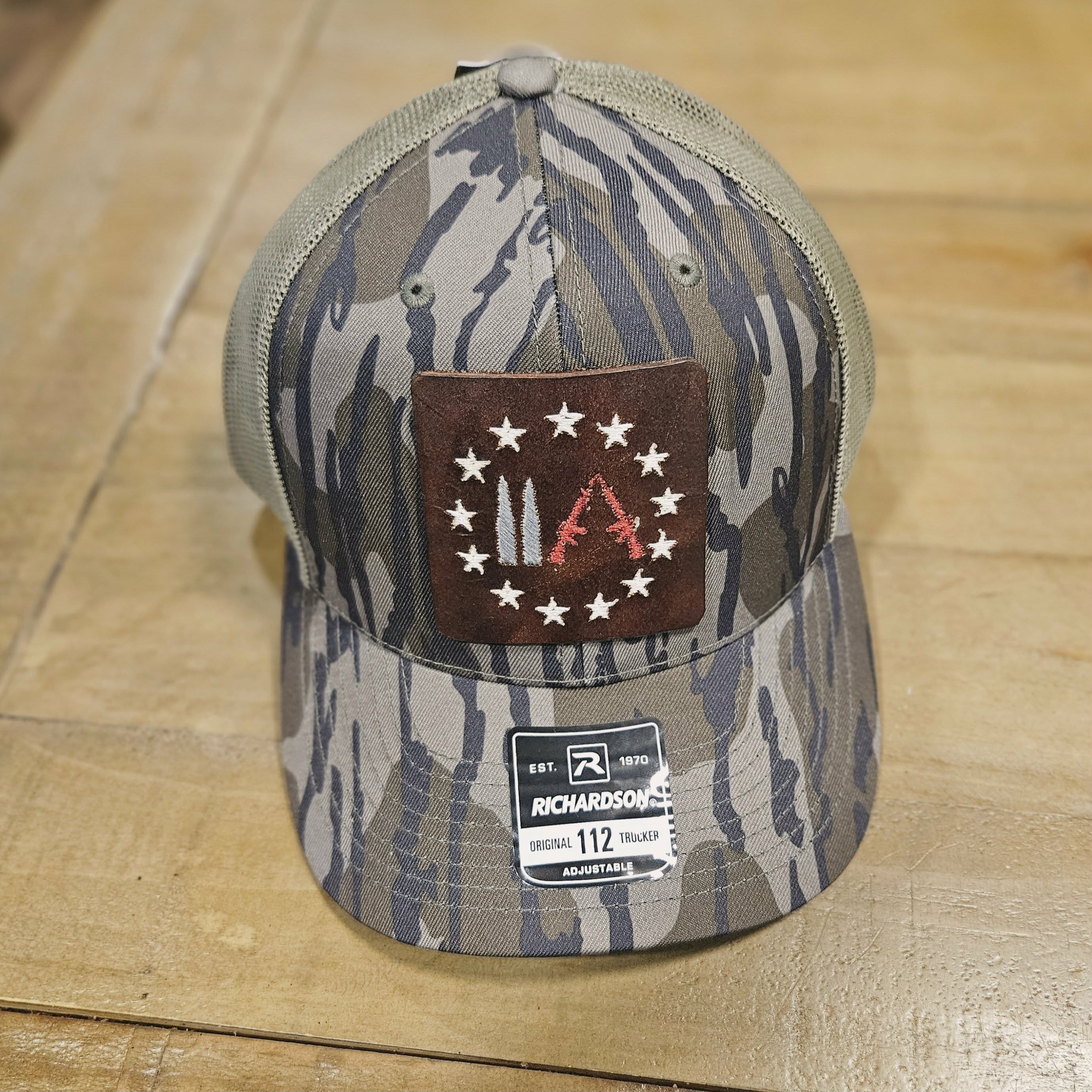 Embroidered Leather Gun Patch Trucker Hat