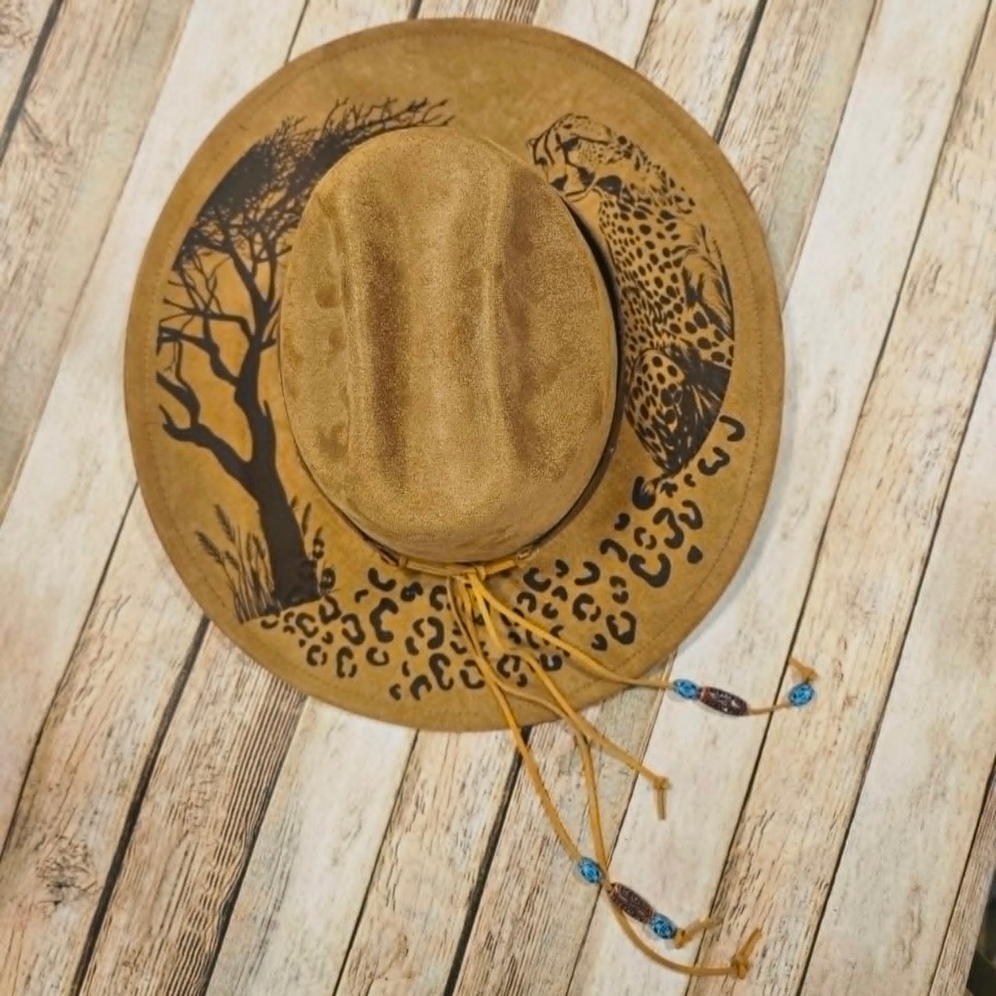 cougar burned large brim hat, willow tree burned hat, laser decorated large brim hat, camel colored leopard burned hat