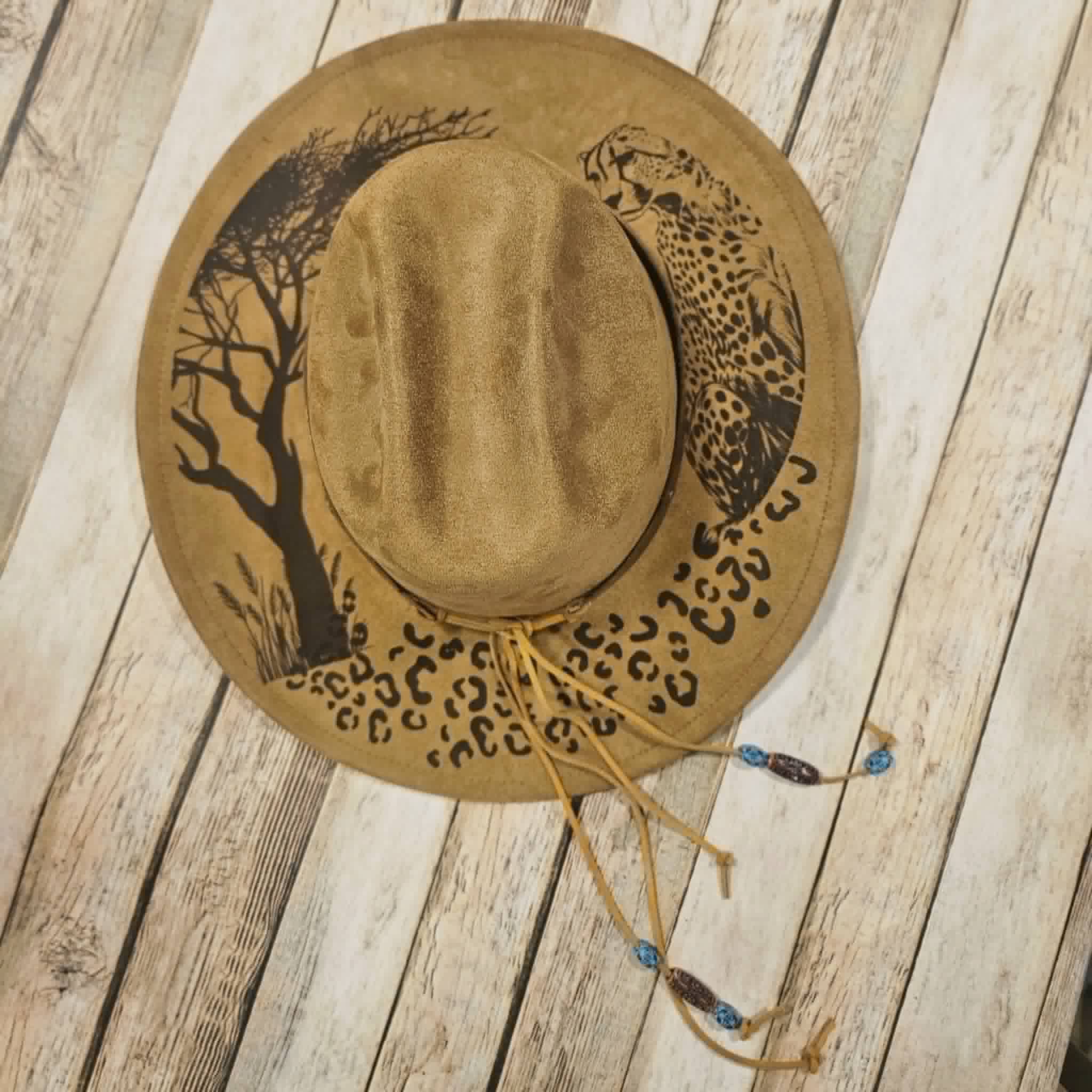 cougar burned large brim hat, willow tree burned hat, laser decorated large brim hat, camel colored leopard burned hat