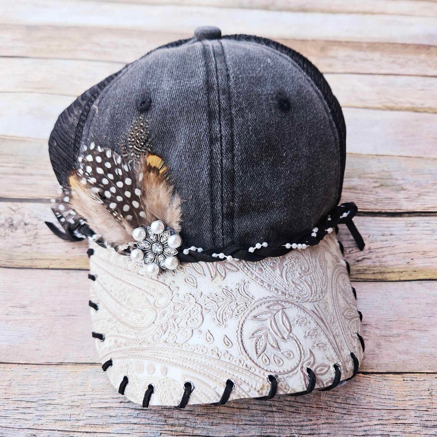 white leather trucker hat, pearl broach hat, feathered trucker hat, black leather lace hat