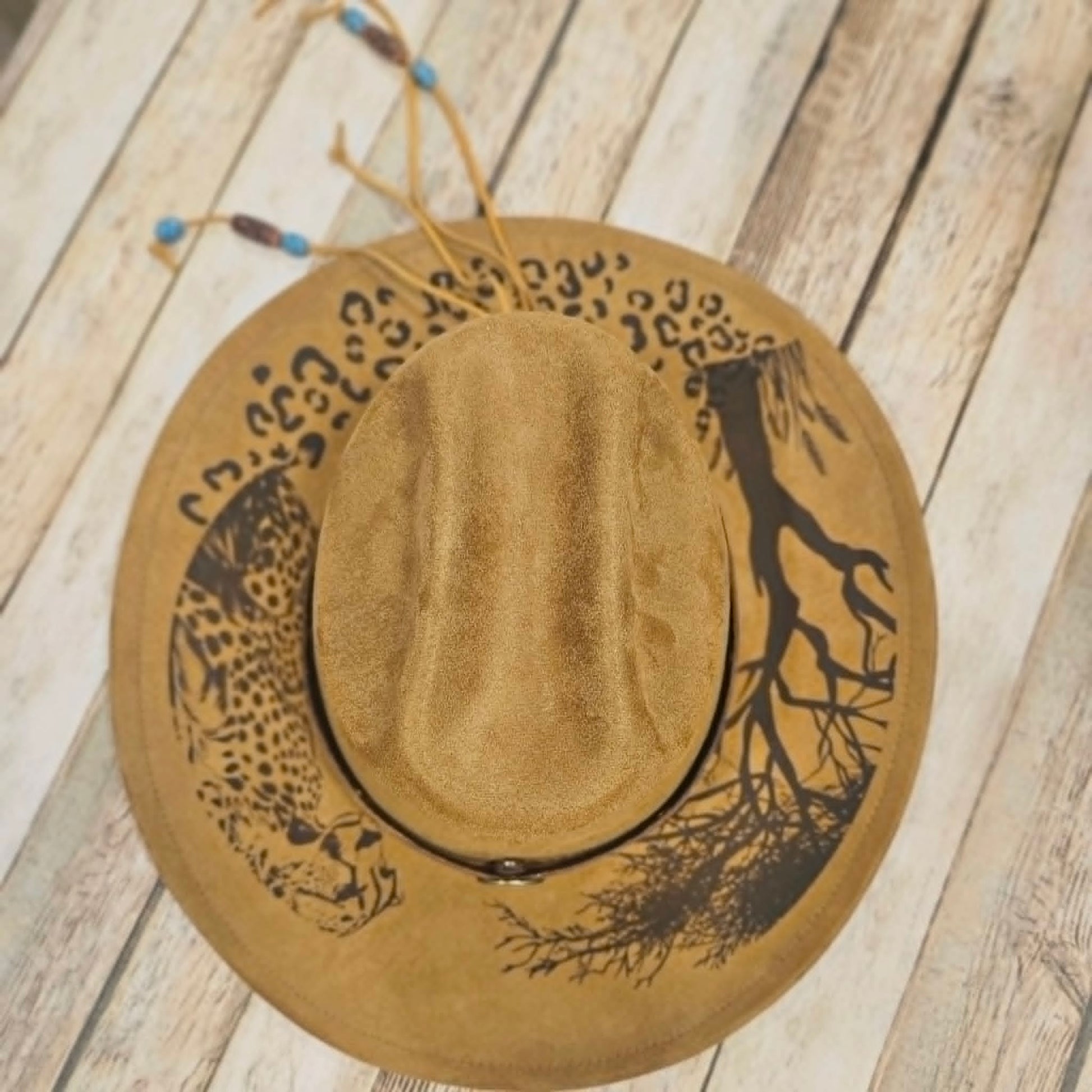 cougar burned large brim hat, willow tree burned hat, laser decorated large brim hat, camel colored leopard burned hat