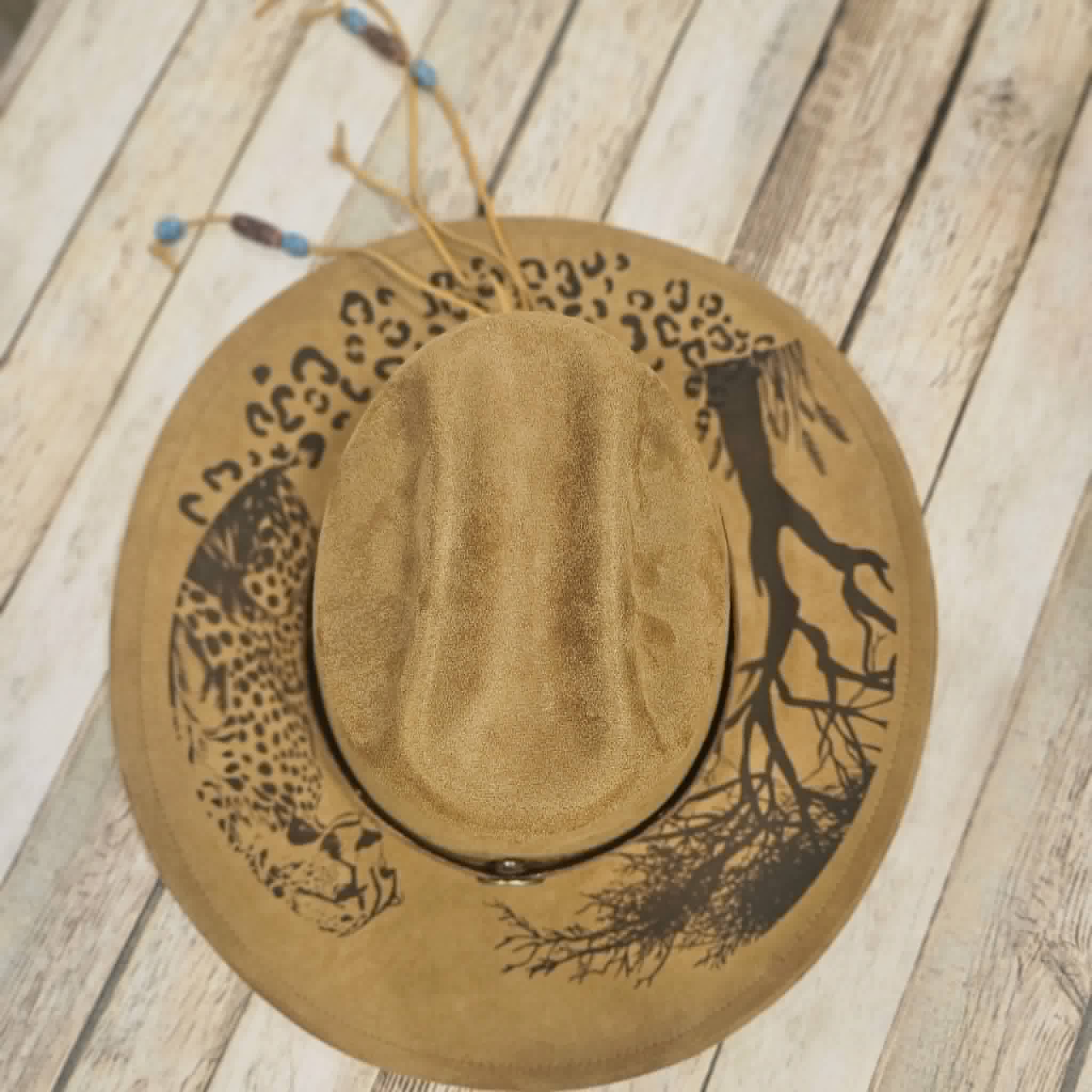 cougar burned large brim hat, willow tree burned hat, laser decorated large brim hat, camel colored leopard burned hat