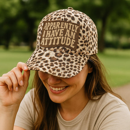 brown and cream leopard crisscross ponytail cap, leather apparently, I have an attitude embroidered patch cap 