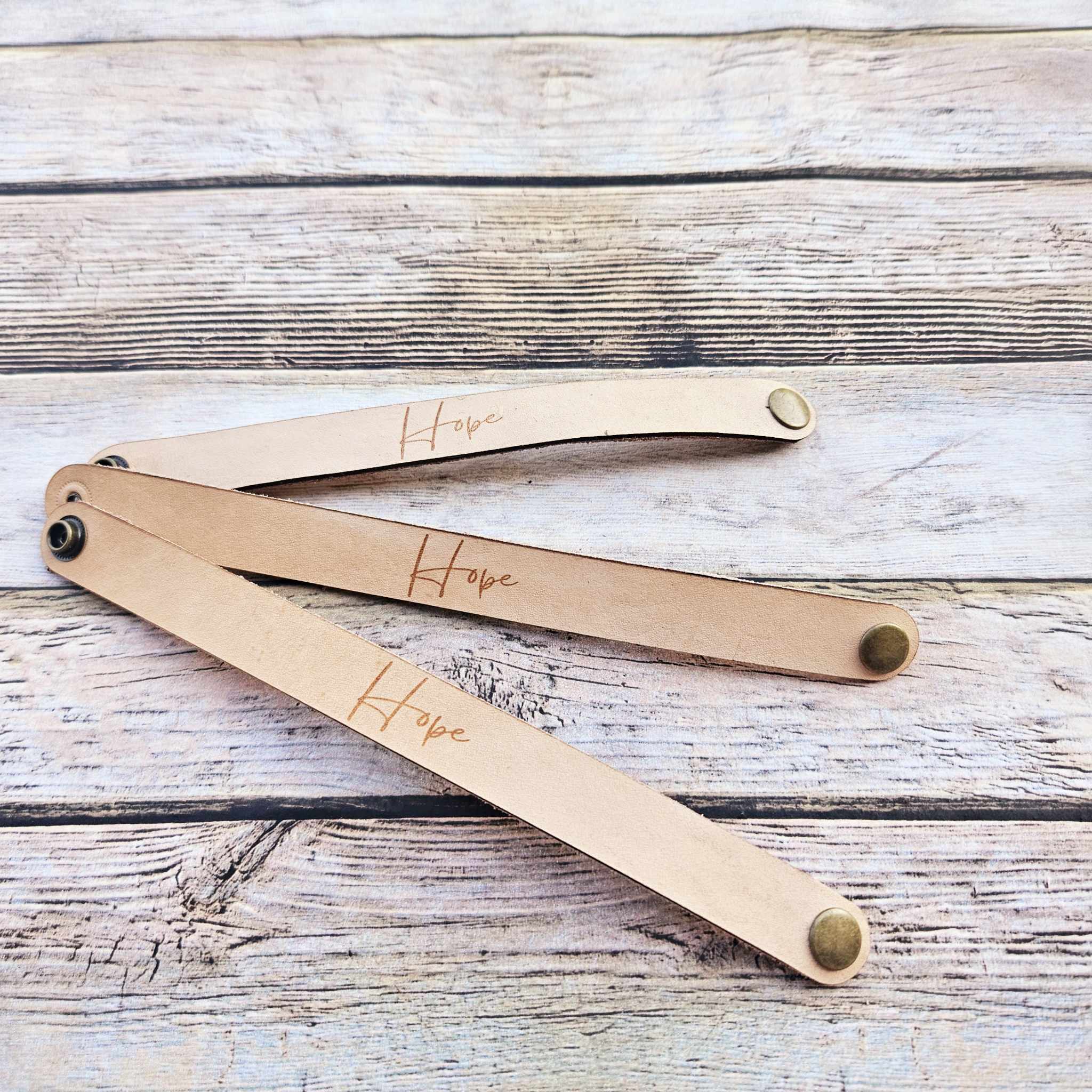 laser leather quote bracelet, strong bracelet, leather snap bracelet, burned leather