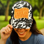 black and white cow print crisscross cap, crisscross ponytail cap, apparently, I have an attitude leather embroidered patch cap, coral embroidered leather patch cap 