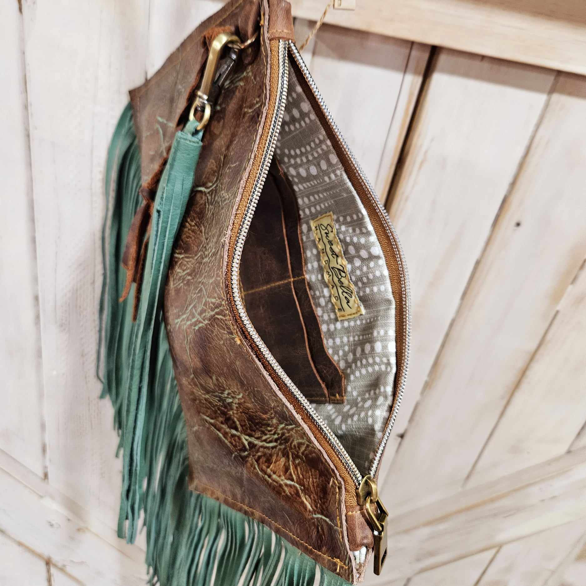 wristlet with leather fringe, leather wristlet, leather fringe wristlet, fringe wristlet, brown and turquoise leather wristlet