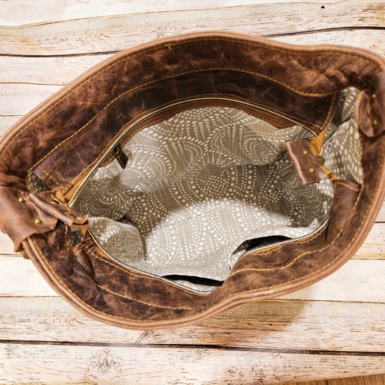Mahala’s Heritage Brown-White Cowhide Convertible Crossbody
